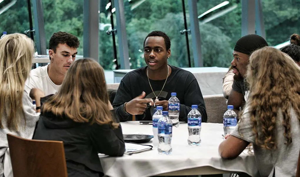 people at a table talking