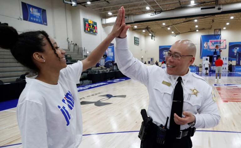 Destiny high-fiving police officer